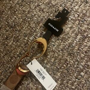 Coach belt size small, brand new with tags attached.